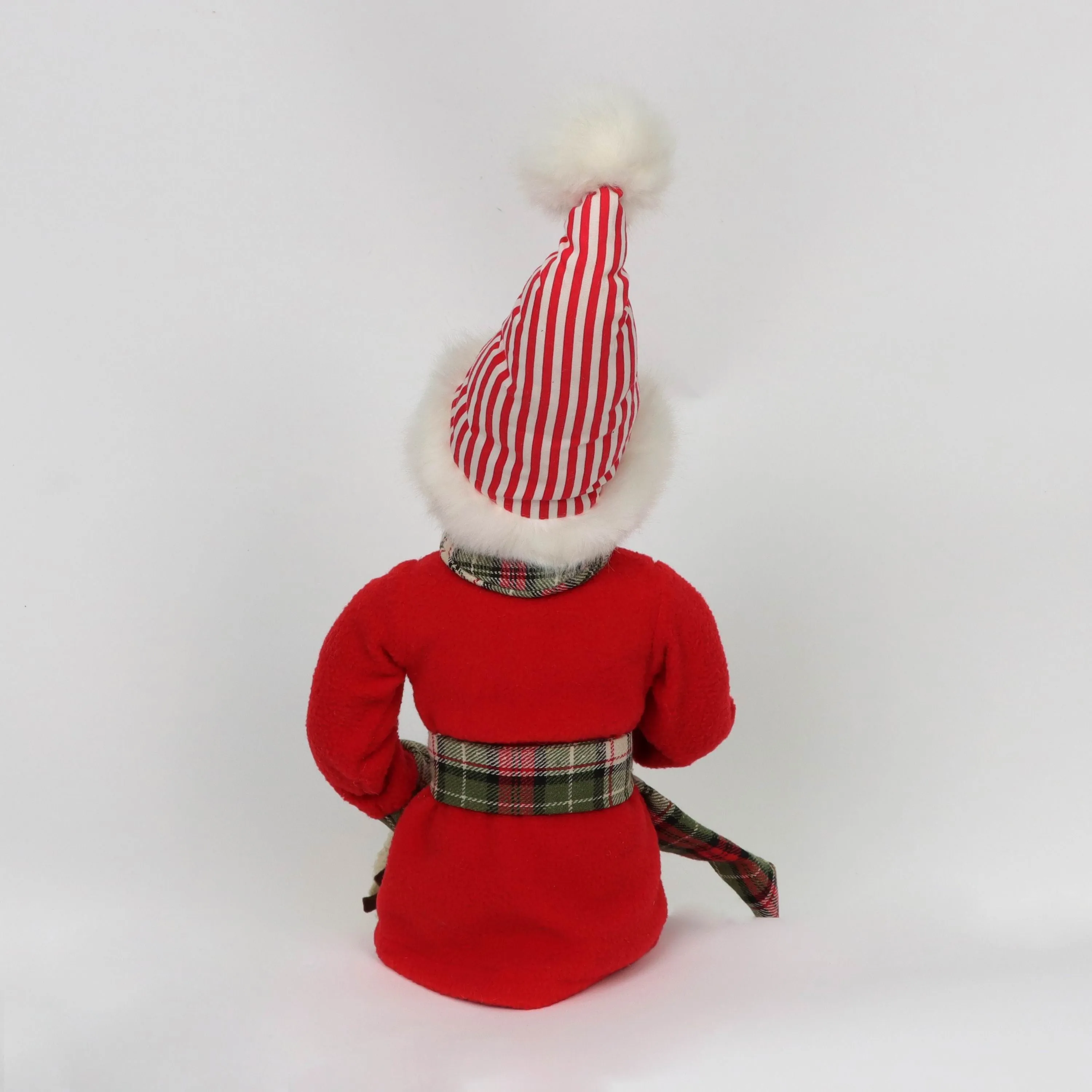 Christmas elf wearing cotton 
pajamas and slippers