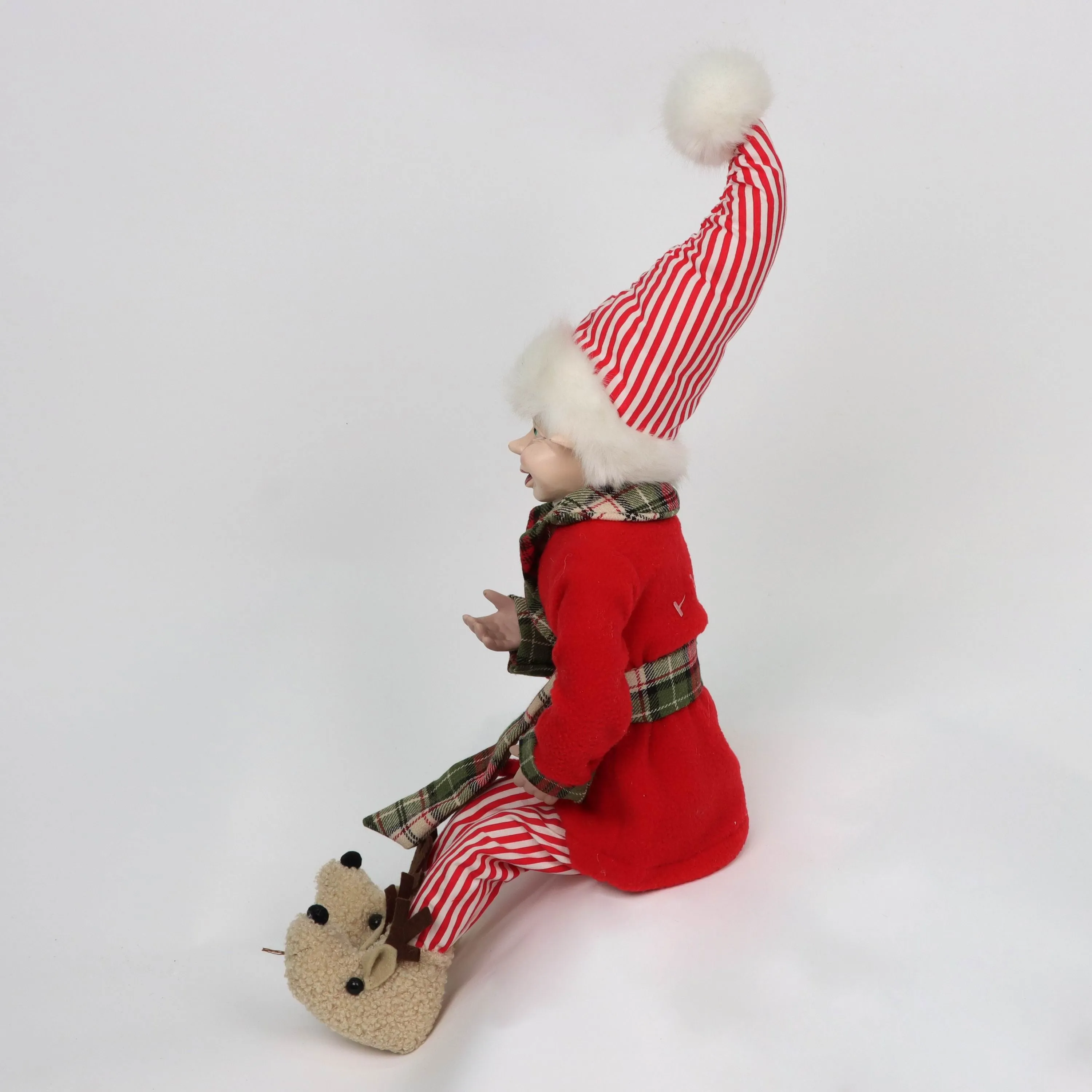 Christmas elf wearing cotton 
pajamas and slippers